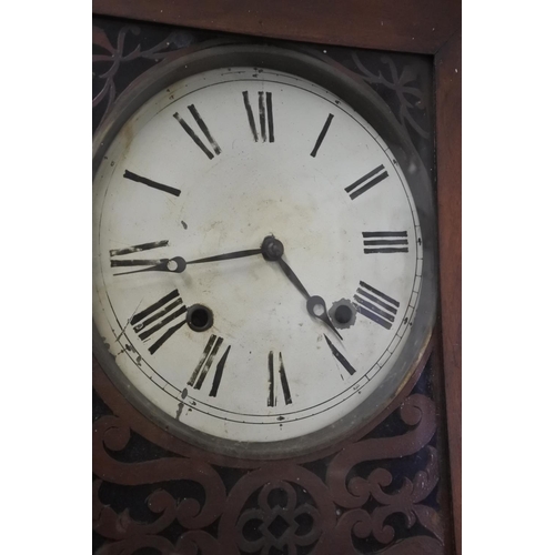 293 - An antique wall clock. Approx 84x36cm.