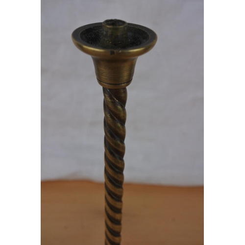 298 - A small early brass stem twisted light base.