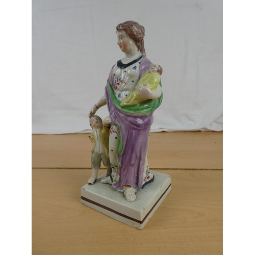 306 - A very early Staffordshire figure, approximately 1790's, with some damage.