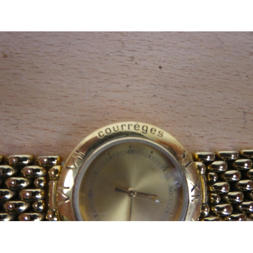 312 - A Courreges dress wrist watch.