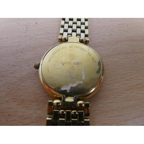 312 - A Courreges dress wrist watch.