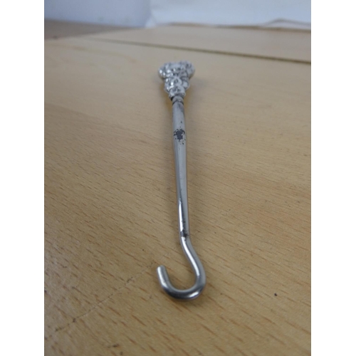 317 - A stunning Sterling Silver handled button hook.