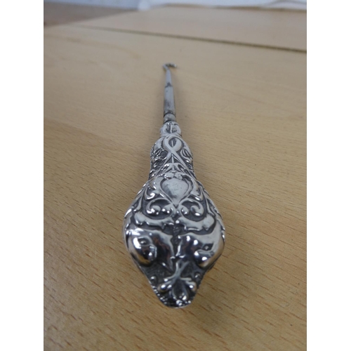 317 - A stunning Sterling Silver handled button hook.