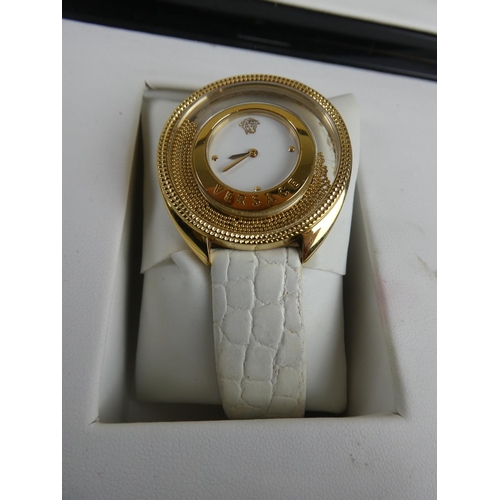 335 - A stunning Versace ladies wrist watch, original receipt and instruction manual in original presentat... 