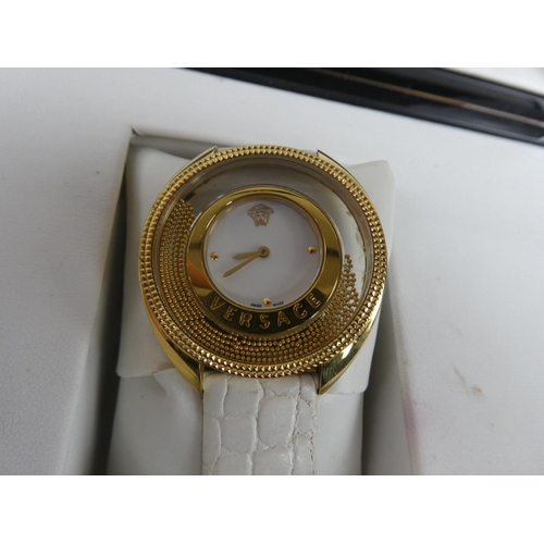 335 - A stunning Versace ladies wrist watch, original receipt and instruction manual in original presentat... 