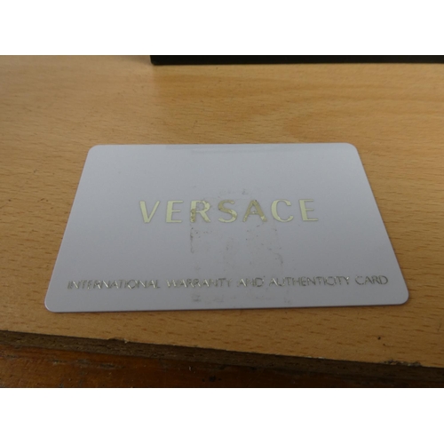 335 - A stunning Versace ladies wrist watch, original receipt and instruction manual in original presentat... 