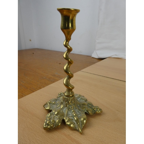 337 - A collection of miniature brass candlesticks.