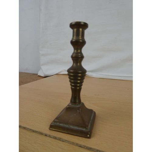 337 - A collection of miniature brass candlesticks.