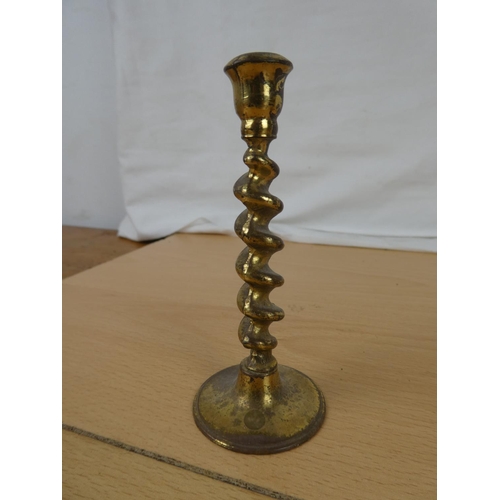 337 - A collection of miniature brass candlesticks.