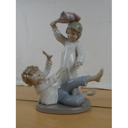 344 - A large Nao figure of children playing.