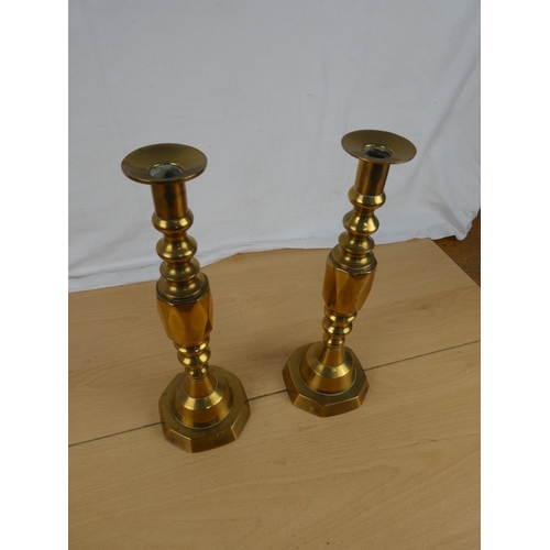 347 - A stunning pair of brass candlesticks.