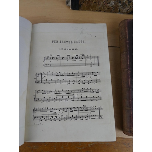 353 - Three antique music books.