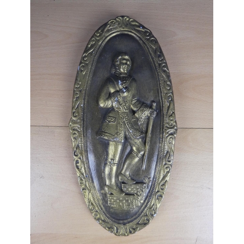 379 - A large ceramic and gilt wall plaque of a gent. Approx 37cm.