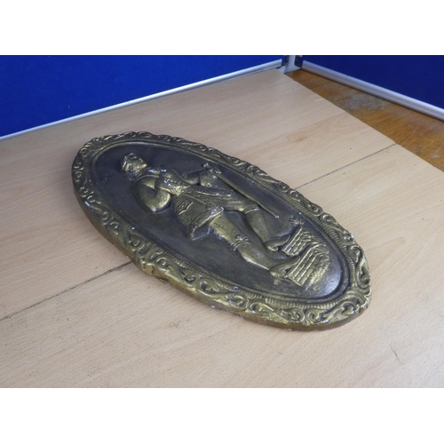 379 - A large ceramic and gilt wall plaque of a gent. Approx 37cm.