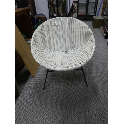 394 - A vintage plastic rattan style chair.