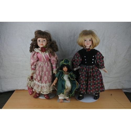 405 - Three ceramic faced collectors dolls.