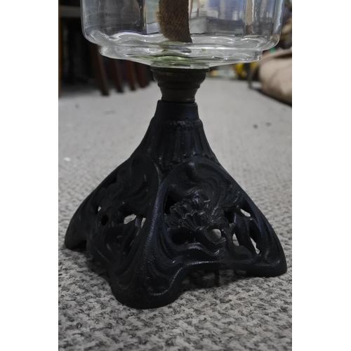 428 - An art nouveau iron based oil lamp.