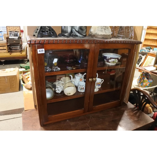 429 - A wall mounted two door display cabinet.