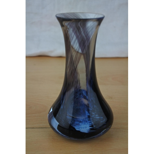 435 - A blue glass bud vase.