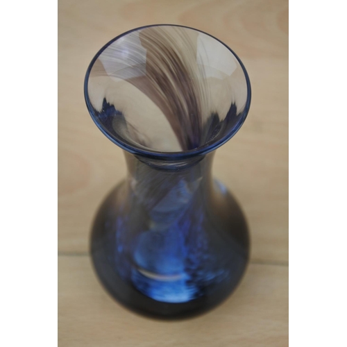 435 - A blue glass bud vase.