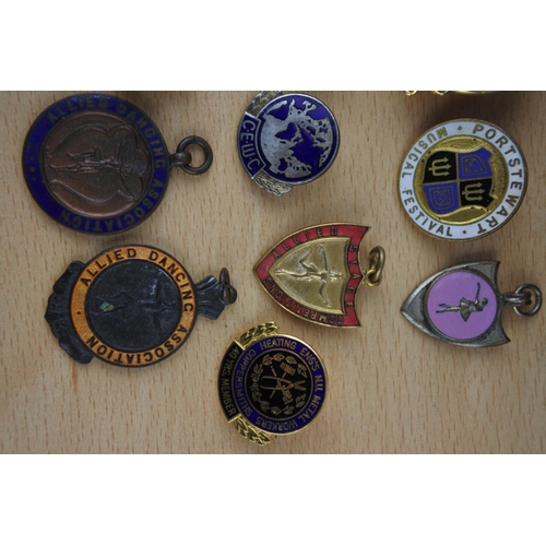 437 - An assorted lot of badges and medals,