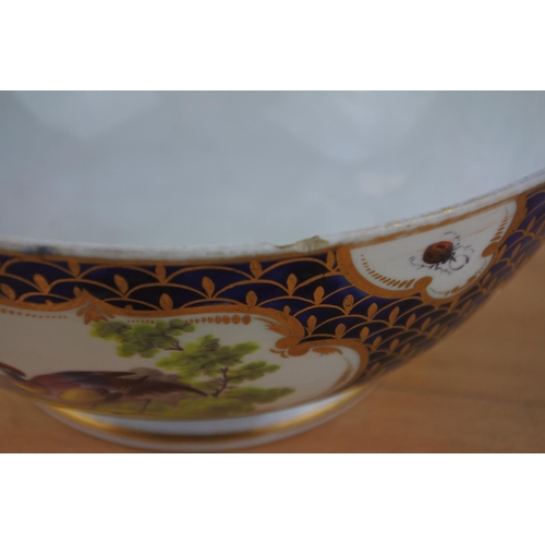 438 - An antique bowl with hand painted birds (a/f),