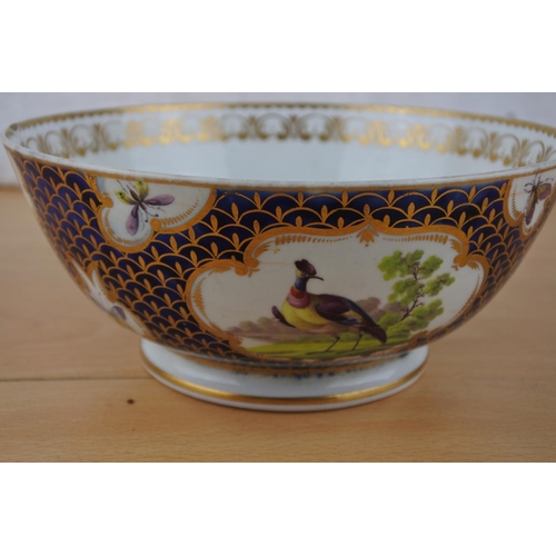 438 - An antique bowl with hand painted birds (a/f),