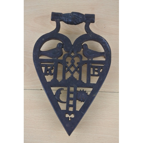 443 - A masonic trivet.