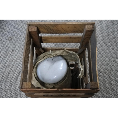 452 - A wooden crate with large lightbulb.