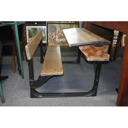 455 - A stunning antique pine school desk with cast iron frame, measuring 92cm x 52cm x 65cm approximately... 