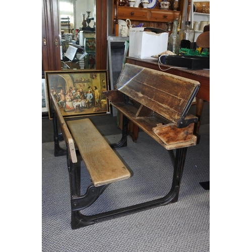 455 - A stunning antique pine school desk with cast iron frame, measuring 92cm x 52cm x 65cm approximately... 