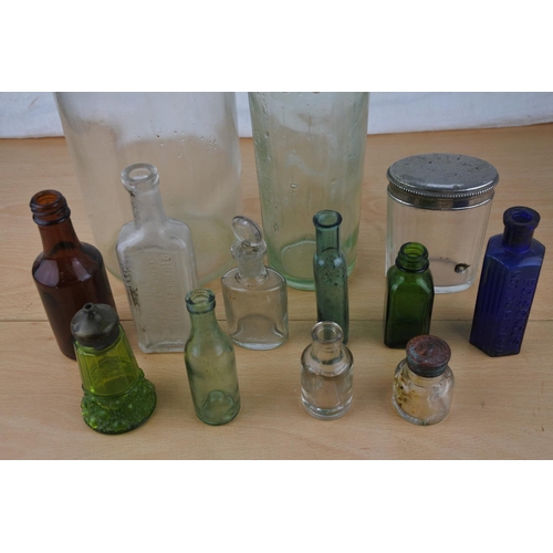 463 - A collection of vintage glass bottles.