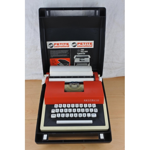 464 - A vintage cased Petite typewriter.