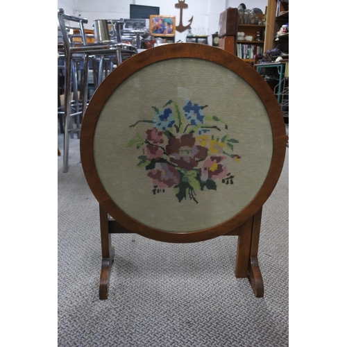 465 - An oak framed tapestry firescreen/table.