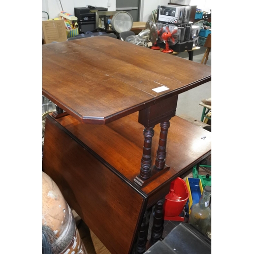 466 - An antique double sutherland table on casters.