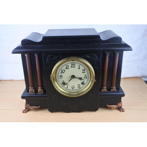 482 - An antique New Haven, USA mantle clock, striking and in perfect working order.