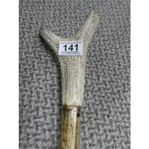 141 - A horn handled shepherd crook and another. Approx 162cm and 80cm.