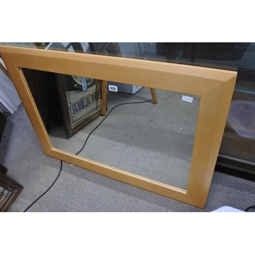 608 - A large framed mirror.