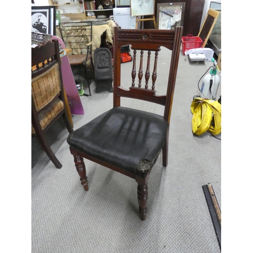 500 - An antique mahogany framed hall chair in need of upholstery.