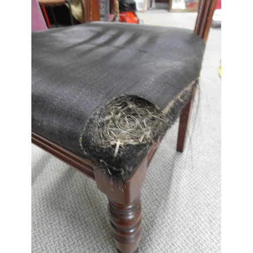 500 - An antique mahogany framed hall chair in need of upholstery.