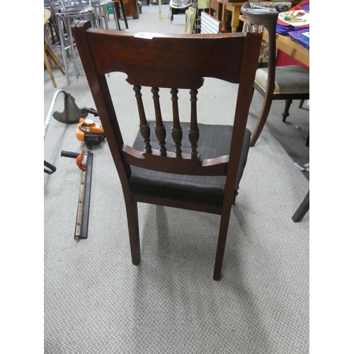 500 - An antique mahogany framed hall chair in need of upholstery.