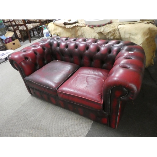 537 - A stunning Chesterfield oxblood two seater settee.