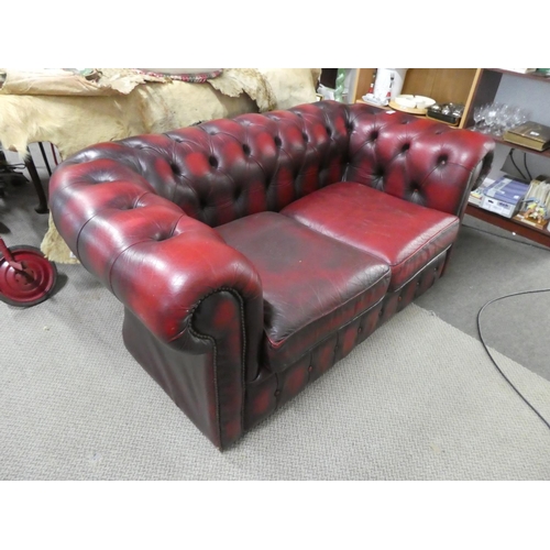 537 - A stunning Chesterfield oxblood two seater settee.