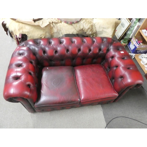 537 - A stunning Chesterfield oxblood two seater settee.