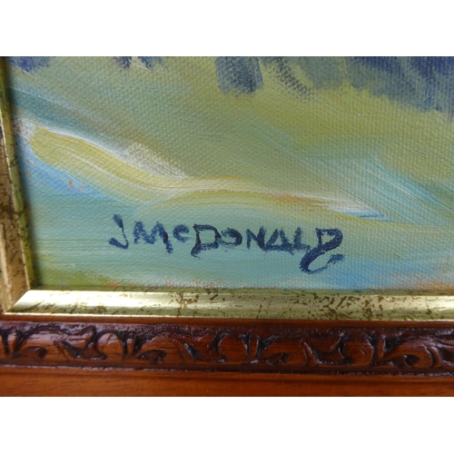 538 - A framed oil painting of horses signed J McDonald.