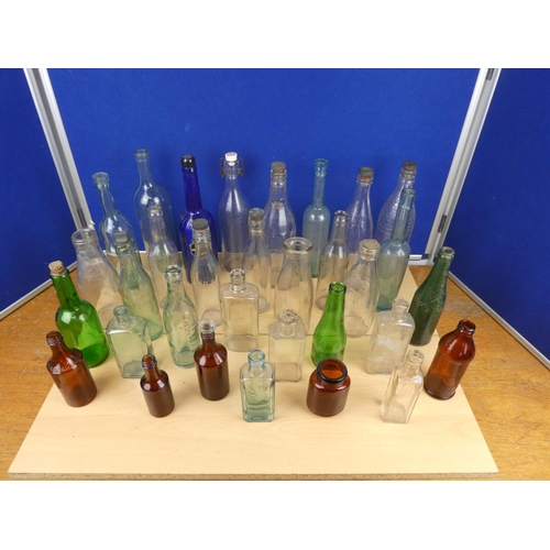 540 - A large lot of vintage glass beer and other bottles.