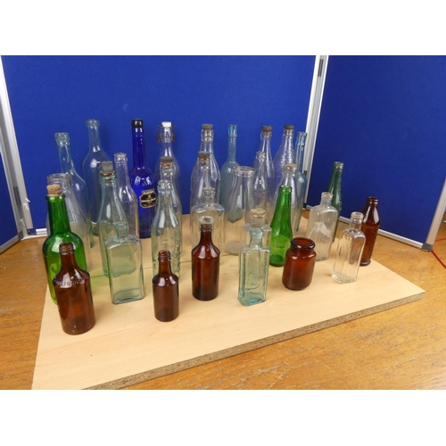 540 - A large lot of vintage glass beer and other bottles.