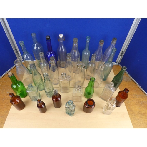 540 - A large lot of vintage glass beer and other bottles.