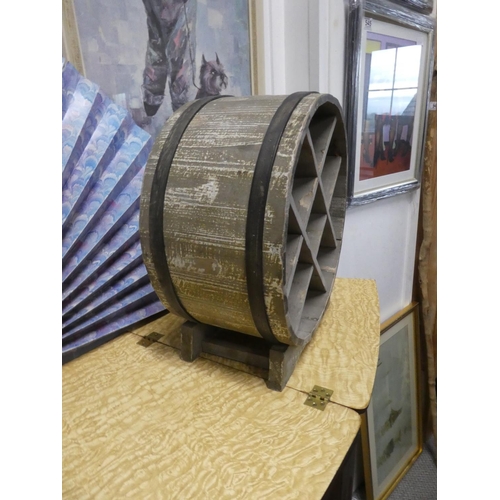 547 - A barrell shaped wine rack.