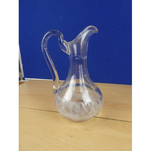 552 - A vintage glass jug.